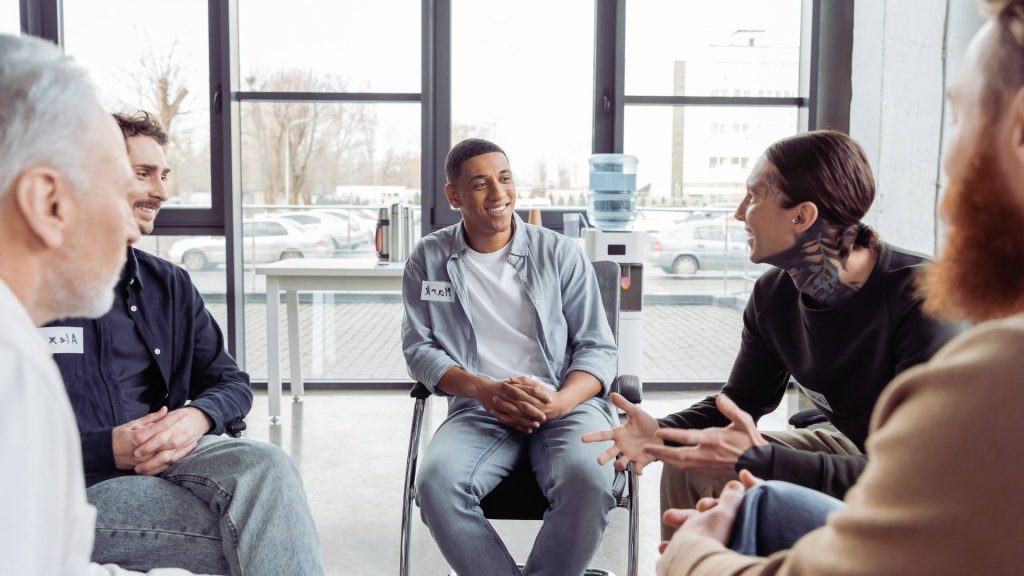 group of men talking about planning addiction recovery