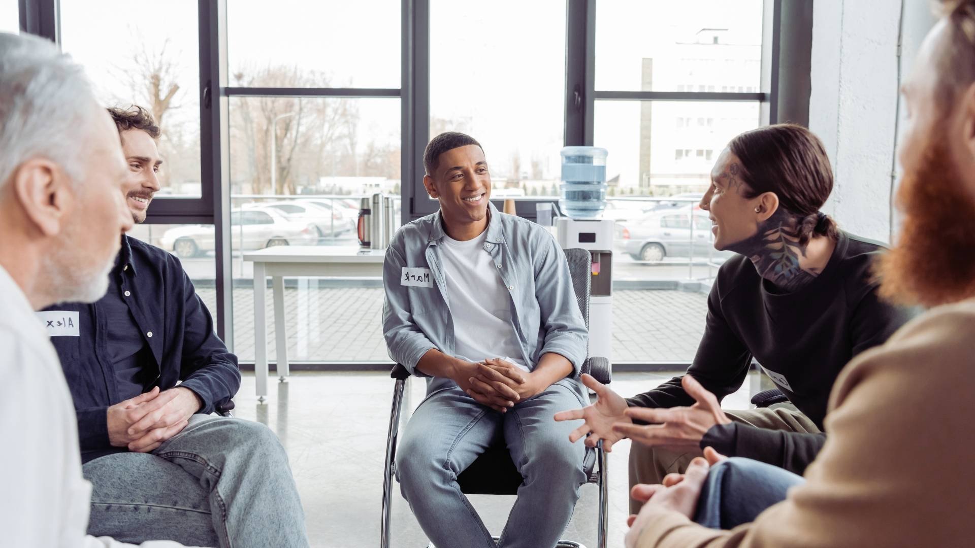 group of men talking about planning addiction recovery