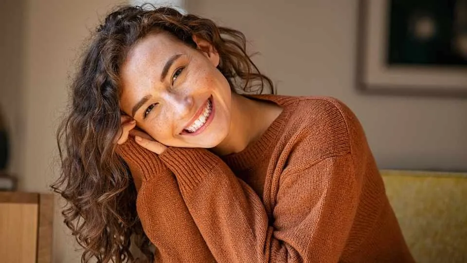 how long does drug detox take A woman smiles after overcoming detox