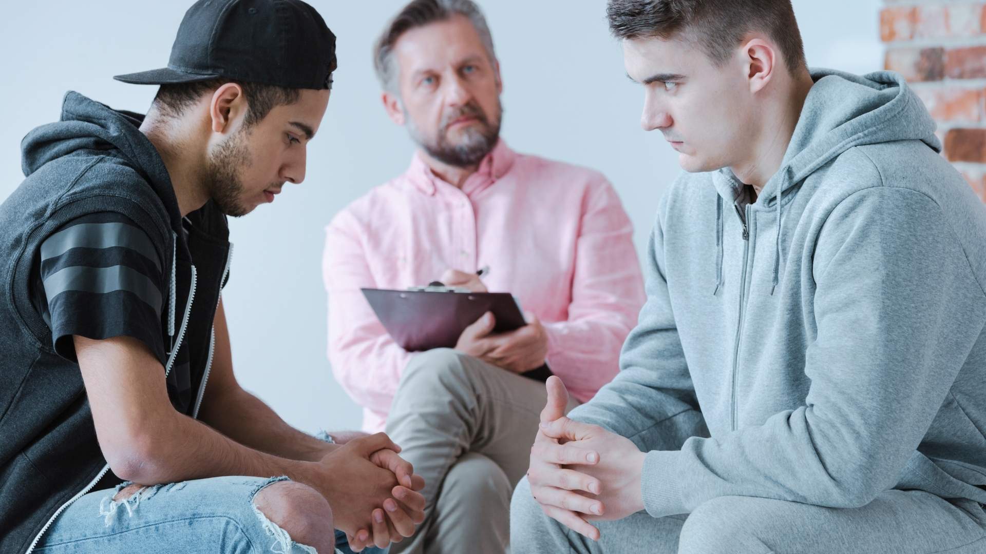two men talking to a doctor about risks from codine overdose