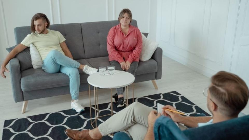 A couple in family therapy for addiction working on codependent patterns in the household
