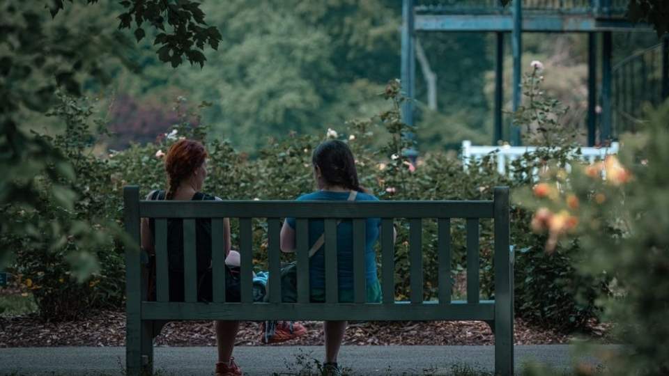 Two women talking about getting help rather than facing alcohol kindling alone
